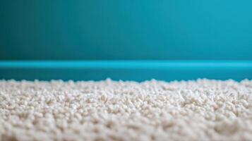 A close up of a carpet with blue walls photo
