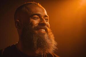 A man with a full beard smiles warmly in a soft orange light, conveying happiness and warmth in a captivating moment photo