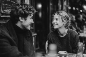 Two people share smiles while engaged in a warm conversation at a charming cafe filled with soft ambient light photo