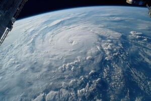 An impressive view of a hurricane rotating above Earth, showcasing clouds and weather patterns from the International Space Station photo