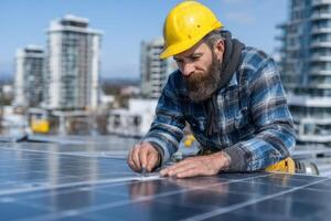 A skilled worker focuses intently on installing solar panels atop a high-rise building on a clear, sunny day in the city photo