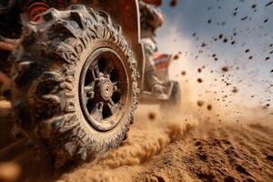 An all-terrain vehicle navigates through sandy terrain, sending clouds of dust into the air under a clear blue sky photo