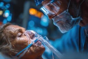 A dedicated caregiver provides support to an elderly patient wearing an oxygen mask in a dimly lit intensive care unit photo