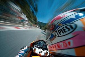Racer navigates a sharp turn on a twisting road, showcasing skill and speed against a clear blue sky and lush landscape photo