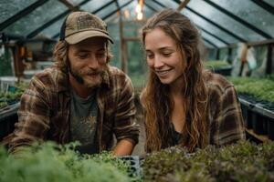 A couple is tending to plants in a cozy greenhouse while enjoying a light rain outside, sharing smiles and gardening tips photo