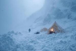 A person trudges through deep snow towards a tent amid heavy snowfall in a remote mountain location during winter photo