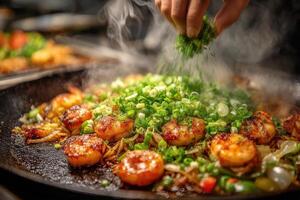 A chef sprinkles fresh herbs over shrimp and vegetables being cooked in a hot skillet, creating a flavorful dish in a lively kitchen photo