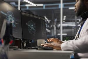 Engineer working on PC in data center housing artificial intelligence infrastructure. IT expert using computer in server hub workspace filled with AI machine learning supercomputers photo