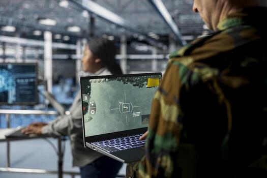 Team of military experts in data center doing mission coordination, operating satellite lock systems. Army units wearing uniform in server farm receiving real time battlefield intel from photo