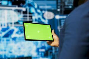 Professional guy in a high tech space uses mockup screen with AI modern tools, representing artificial intelligence data structures and intelligent systems. Innovation and cybernetics for science. photo