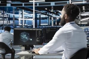 Server farm employee using AI algorithms categorizing and clustering unstructured data. Data center system administrator using Natural Language Processing tech analyzing information photo