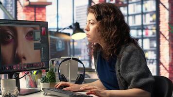 Graphic designer uses professional retouching software for photos and editing the skin, working with retouching interface program for post production. Creating high quality materials. Camera B.