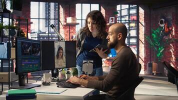Professional editor uses AI powered software and PC reels in a creative office, marketing strategy used in targeting viral trends and boosting online followers and exposure. Camera A. photo