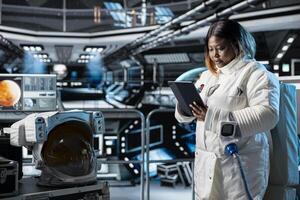 Astronaut studies mission plans before Mars expedition aimed at preparing for future of mankind. Crew prepares to explore planet surface in search of signs that could support human life beyond Earth photo