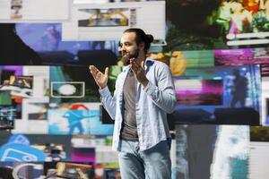 Relaxed speaker connects with a virtual audience during a live social media event, showcasing innovation and real time interaction to ensure engagement and reach, brand voice. photo
