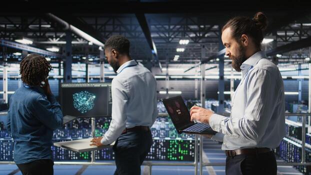 Data center developer frustrated by critical error affecting laptop. Irate server farm worker reacting to hardware performance issues triggered by unresolved software bugs, photo