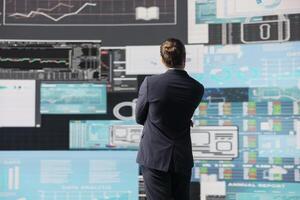 Business person reflecting on monthly company reports for development strategy, reviewing the complexity of business analysis with a focus on finance and forecasting, digital tools. photo