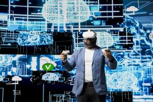 African American engineer working on machine learning with virtual reality tools, implementing models and intelligent systems via neural networks. Programming and cloud computing. photo