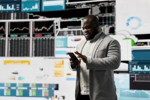 Male business leader analyzing finance charts and analytics for startup development, improving performance models for fruitful management decisions. Administrator studying big data reports. photo
