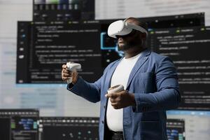 Black IT specialist engineer using VR headset and coding at innovation hub, showcasing the intersection of data science and cloud computing. Coding life with modern AI tools. photo