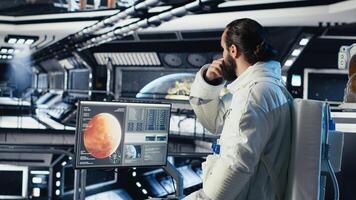 Astronauts flying together in starship exploring Mars, advancing scientific knowledge. Cosmonaut in spacecraft ensuring operational readiness before landing on red planet photo