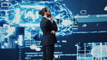Tech savvy businessman employing AI brain data visualization, exploring algorithmic thinking and machine learning through neural networks system. Virtual intelligence in the digital age. Camera B. photo