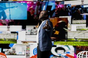 Young black person connecting to global social networks apps through mobile devices, opening platforms online on the dashboard. Communication and multitasking on social media. photo