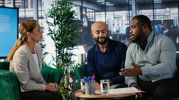 Business meeting in corporate office involving executive decision making, strategic thinking and planning. Diverse professionals ensure organizational growth and performance metrics. Camera B. photo