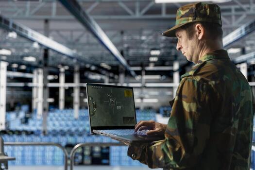 Data center army officer in uniform checking missile targeting software on laptop. Military professional analyzing digital crosshair display in secure server farm facility photo