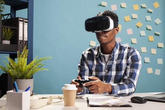 Businessman playing games with VR headset and controller, enjoying an interactive 3D simulation at his desk. Freelancer using virtual reality goggles and a joystick for a good gaming experience. photo