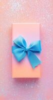 Pastel gift box with blue ribbon photo