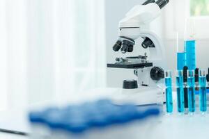 Scientist analyze biochemical samples in advanced scientific laboratory. Medical professional use microscope look microbiological developmental of viral. Biotechnology research in science la photo