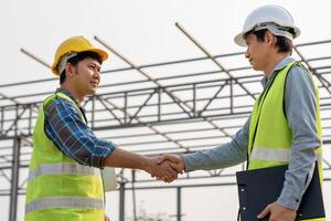 team shaking greeting start up plan new project contract in office center at construction site, industry ,architecture, partner, teamwork, agreement, property, contacts. photo