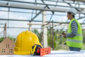engineer is inspecting construction and quality assurance new house using a checklist. Engineers or architects or contactor work to build the house photo