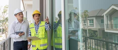 inspector engineer and owner project is inspecting construction and quality assurance new house. Engineers or architects or contactor work to build the house, photo