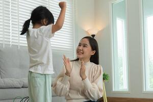 Mother day, Happy mother playing with the little girl. Funny family is happy and excited in the house. mother and daughter have fun spending time together. holiday, weekend, IQ, EQ, meditation, photo