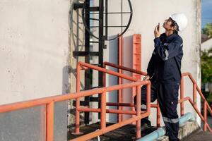 maintenance and inspector. Maintenance engineers are using walky talky to inform the results of inspection of buildings and structures. Irrigation engineers photo