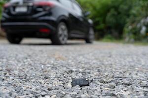 on the ground Car keys dropped on the floor or fall lying on the street home front. Walking Away From Lost Car Key, can not transport, express, rush time, wast time, emergency photo