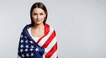 A beautiful young woman holding american flag photo