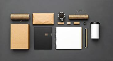 A desk with various items including a notebook, coffee cup, pen, and paper photo