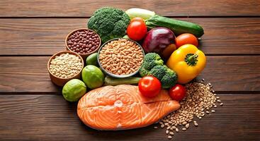 Fresh Salmon Fillet with Colorful Vegetables and Legumes on Wooden Surface photo
