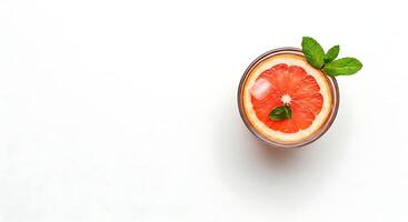 Grapefruit Citrus Drink with Mint Garnish on White Background photo