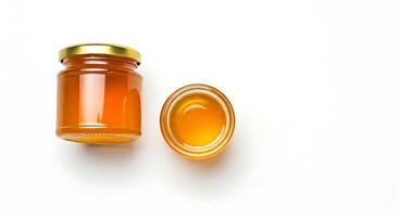 Honey jar and honey on white background photo