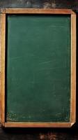 Blank green chalkboard with a wooden frame serves as a versatile surface for writing, teaching, or displaying information in educational environments photo
