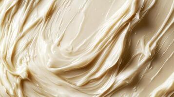 The surface displays a smooth, shiny, and creamy substance that suggests moisture and richness, ideal for enhancing various dishes photo