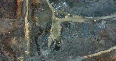 Excavators and dump trucks working in open pit mine. Stock clip video