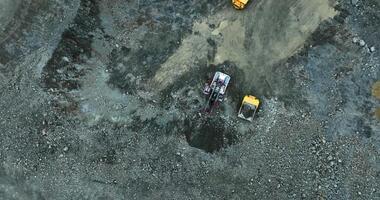 Mining truck unloading gravel into a pit at a quarry. Stock clip video