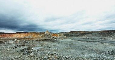 Mining landscape showing eroded terrain and cloudy sky. Stock clip video