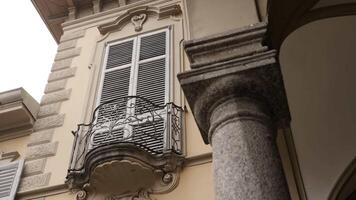 Elegant italian building facade with balcony and column. Action video