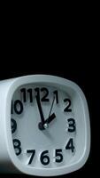 Vertical time lapse of a alarm clock time passing over a day to night. video